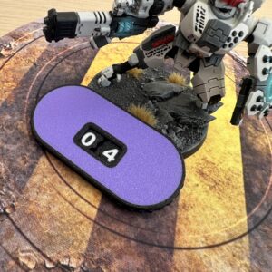 An oval-shaped purple counter with a black border featuring two white mechanical digits displaying the number 04.